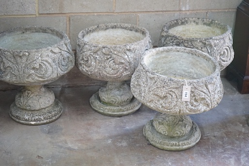 A matched set of four circular reconstituted stone garden planters, moulded with acanthus scrolls, diameter 44cm, height 47cm